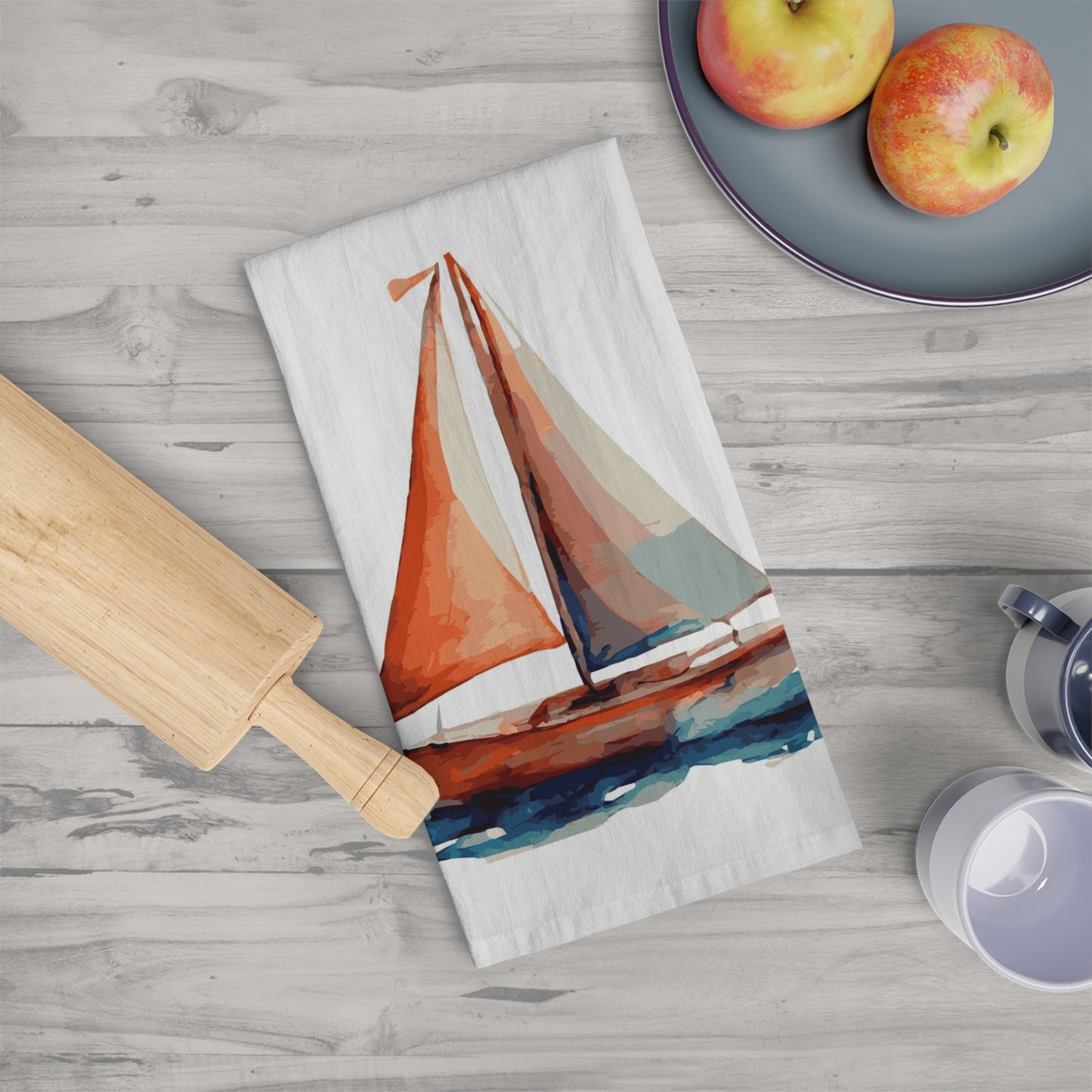 100% cotton tea or dish towel with a colorful printed sailboat